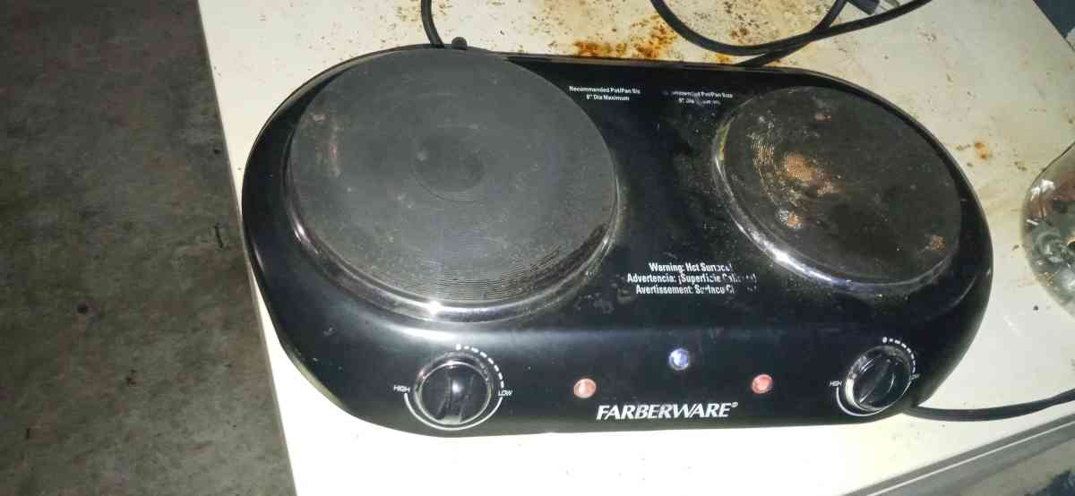 two pot plug in stove top and a flat skillet