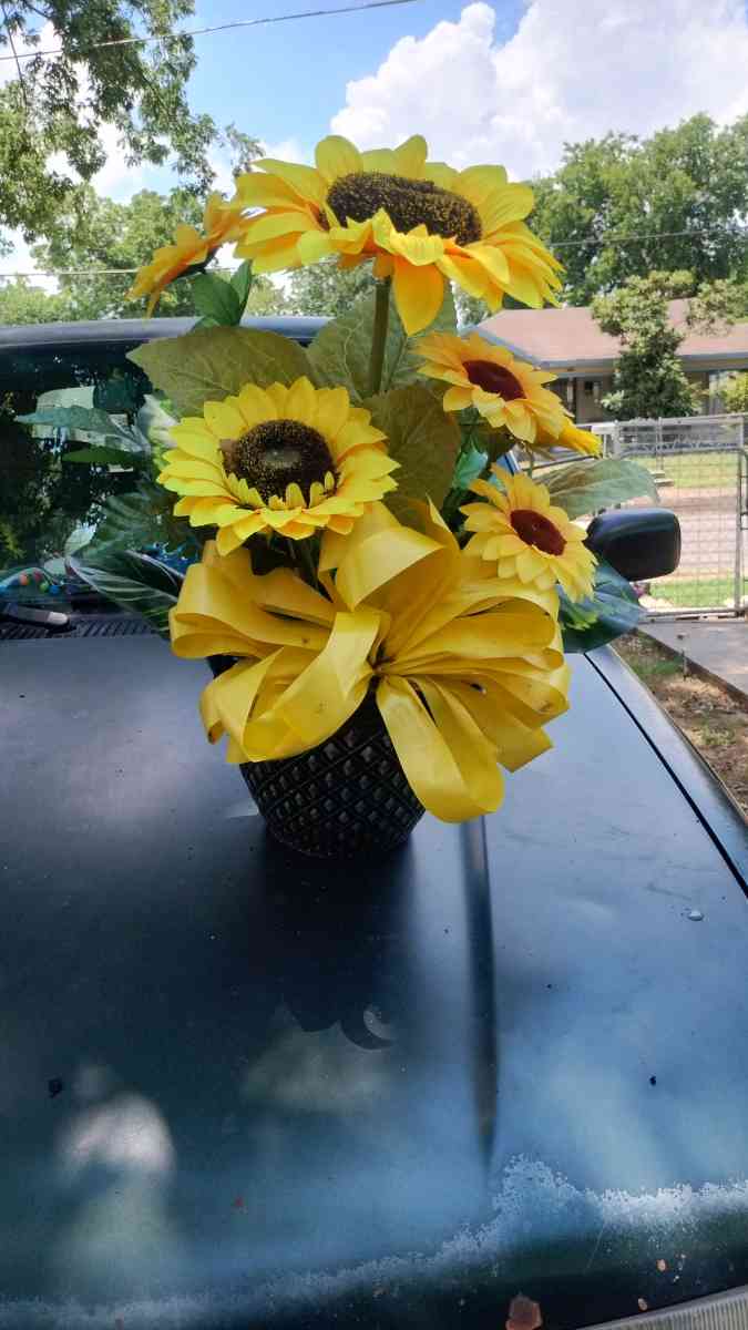 assorted flowers stands  virgin Mary pot