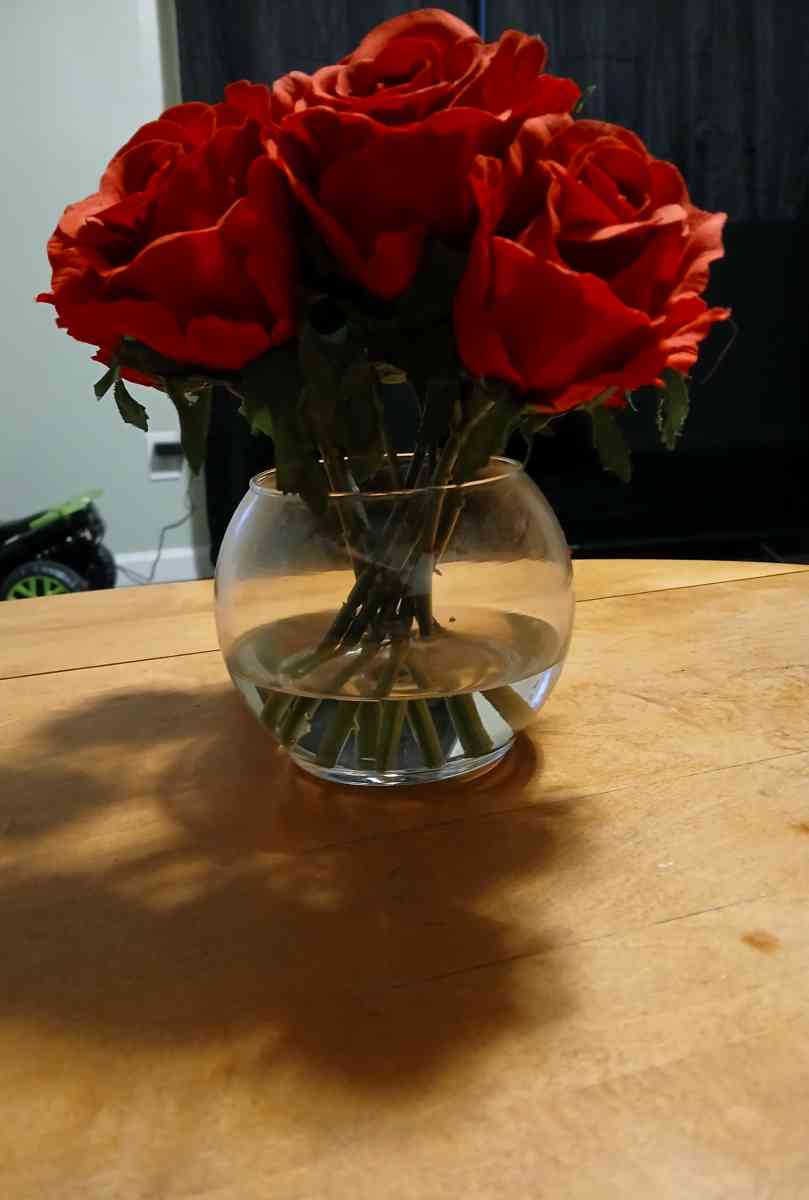 red roses in glass vase