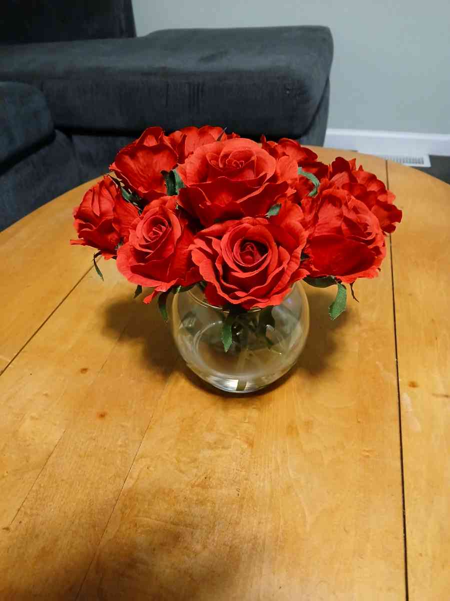 red roses in glass vase