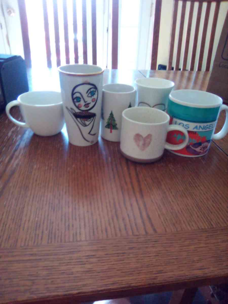 black tablet and Starbucks coffee mugs