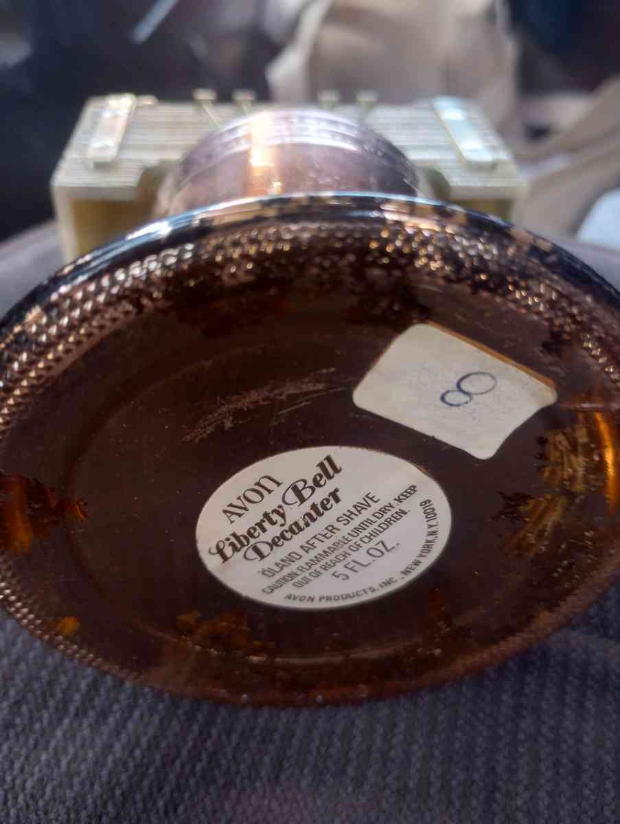 clickers fish scale Avon Liberty container with fluid