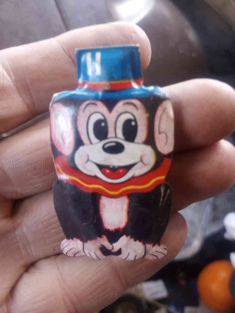 clickers fish scale Avon Liberty container with fluid