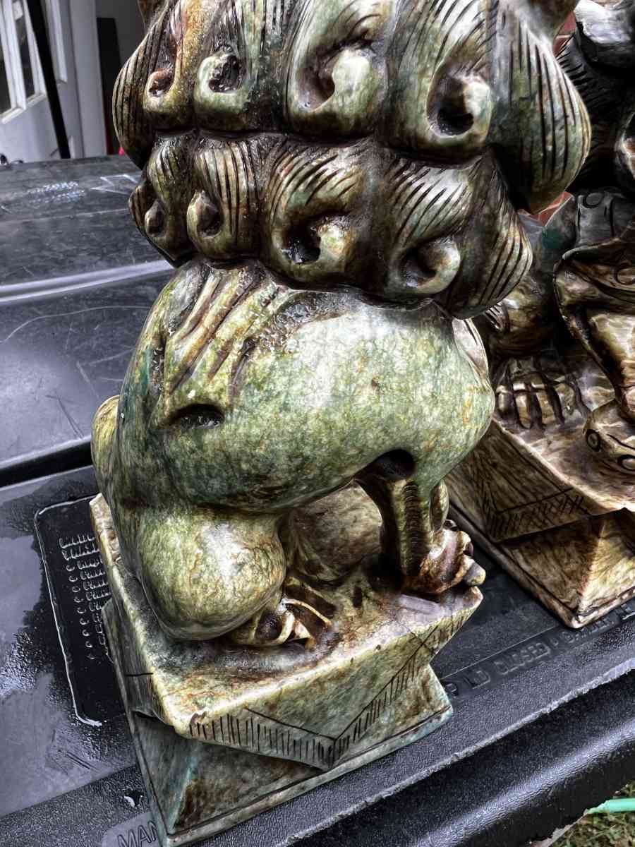 two hand carved statues