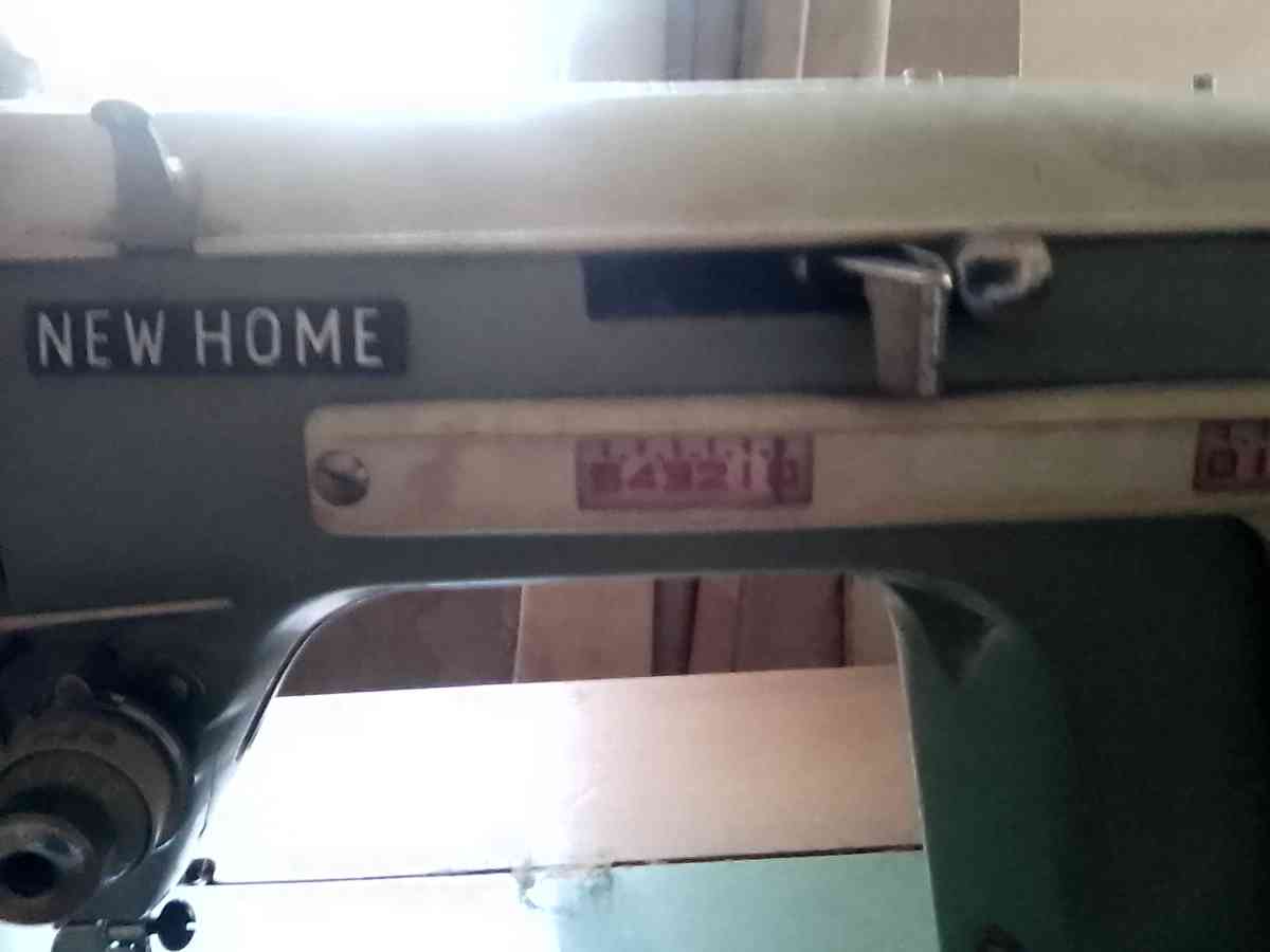 janome sewing machine in cabinet