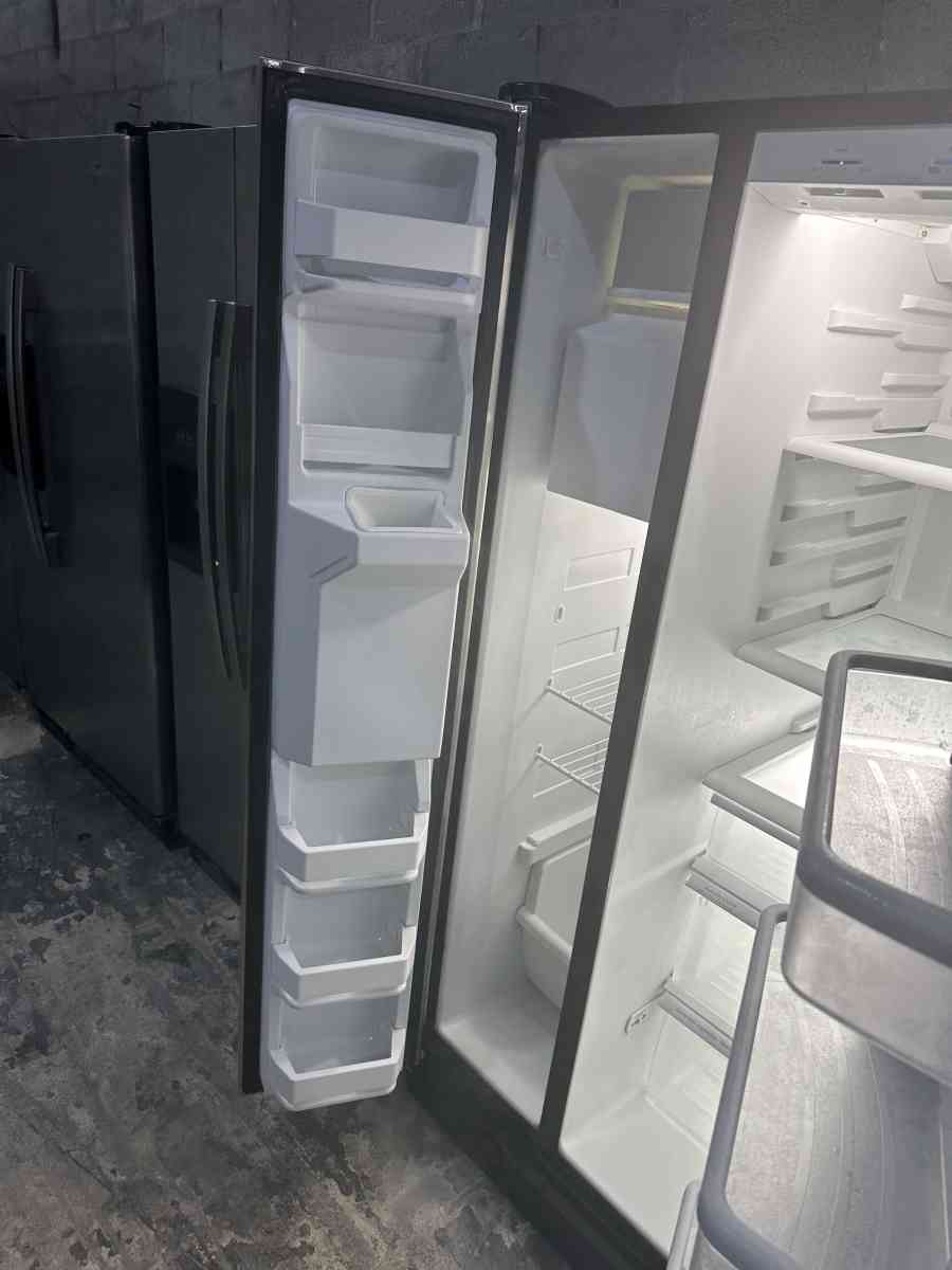 GE refrigerator side by side with water and ice maker dispen
