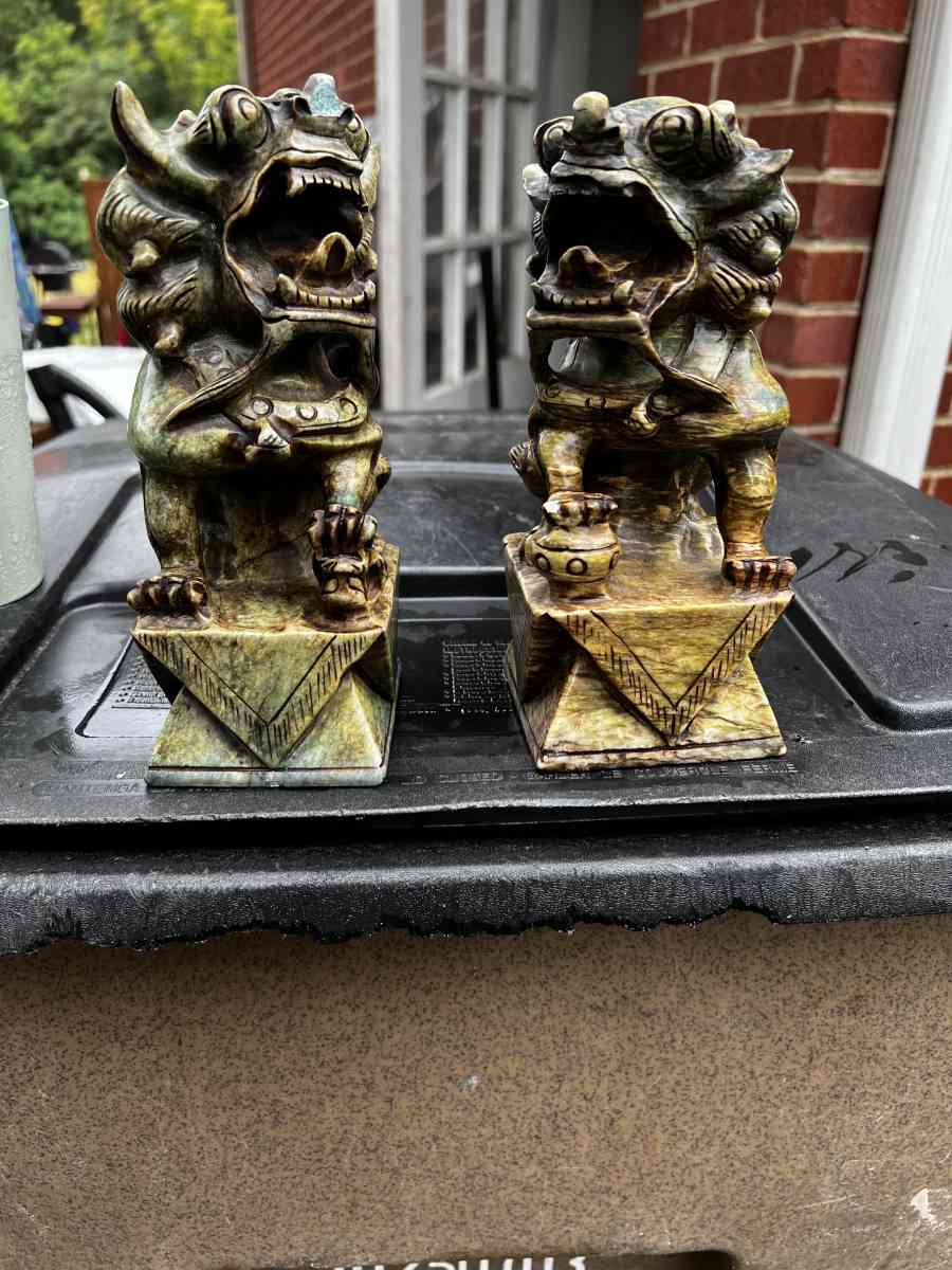 two hand carved statues