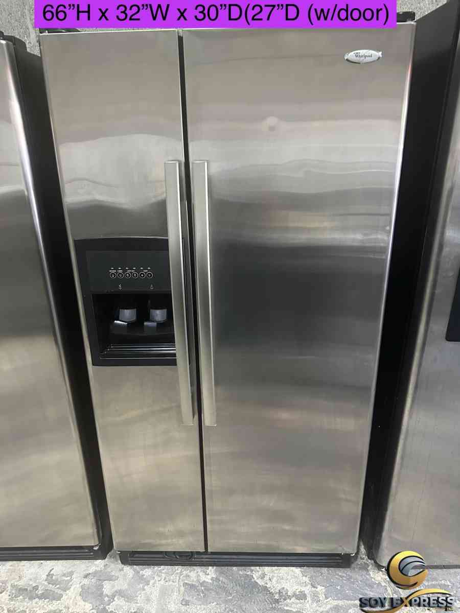 GE refrigerator side by side with water and ice maker dispen