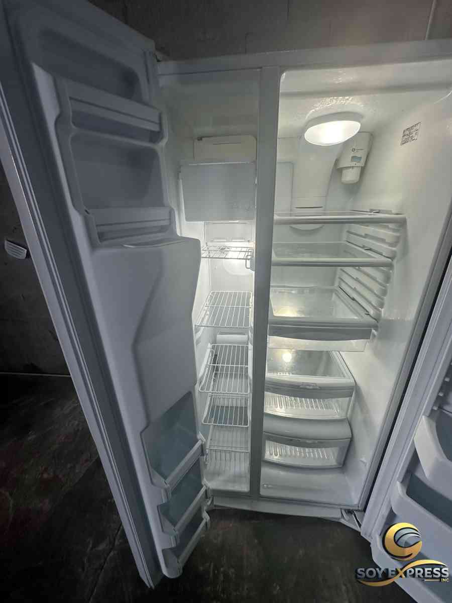 GE refrigerator side by side with ice and water dispenser