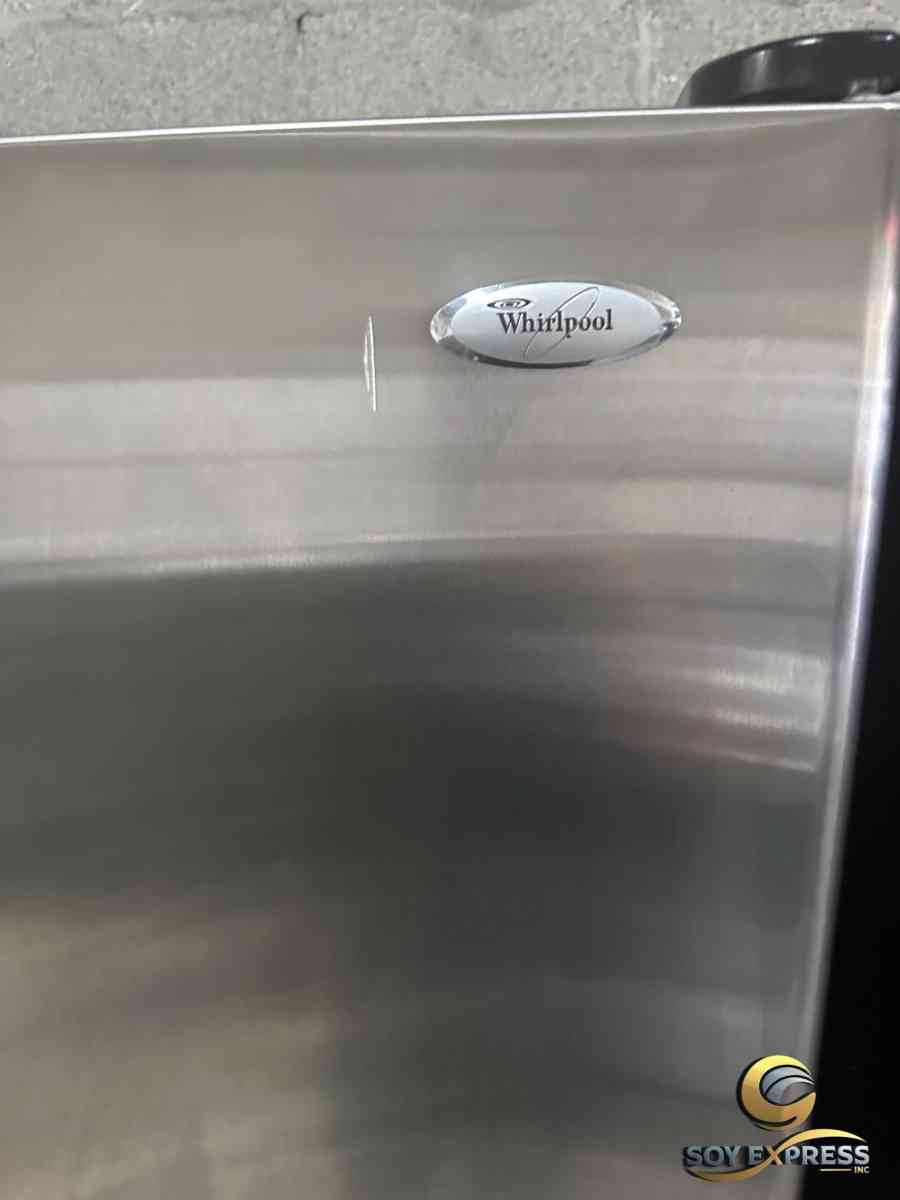 GE refrigerator side by side with water and ice maker dispen