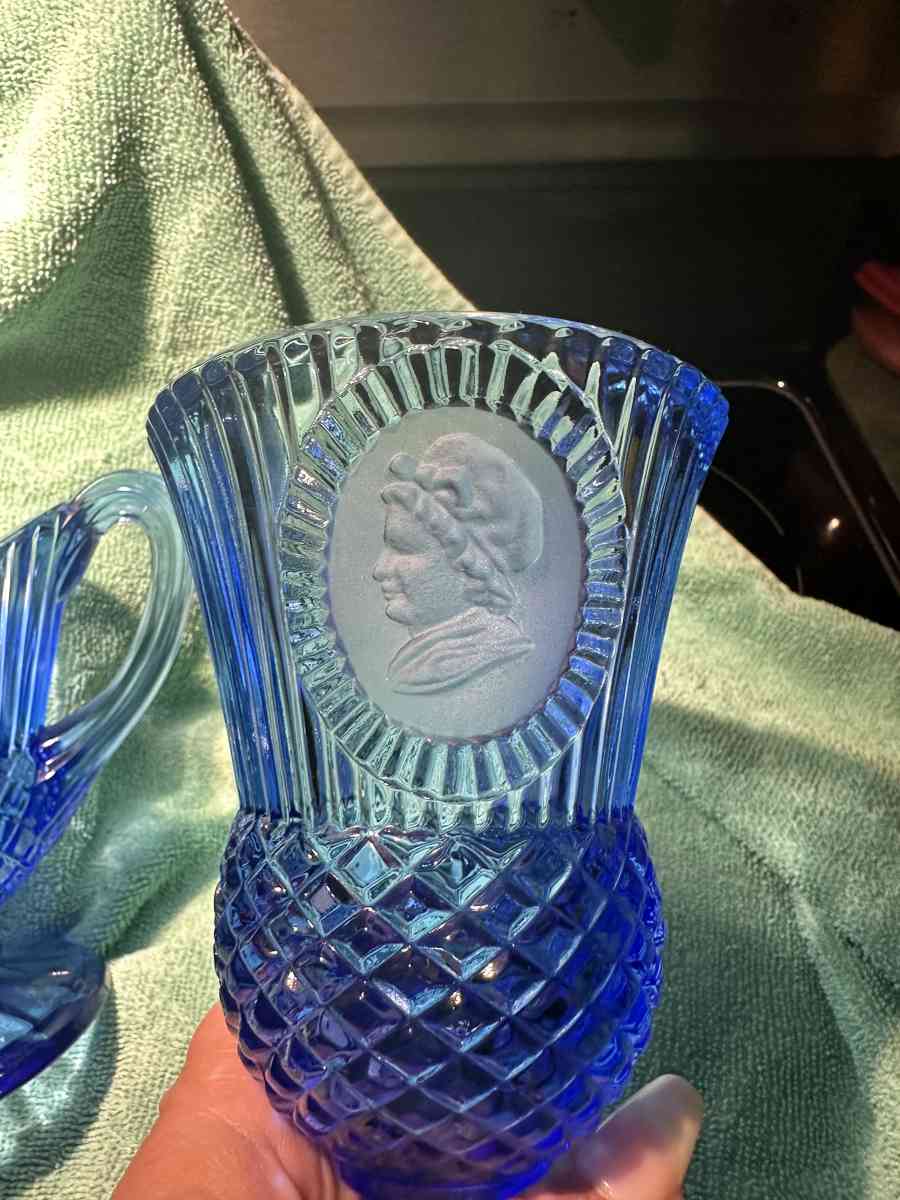 blue glass goblets and pitcher