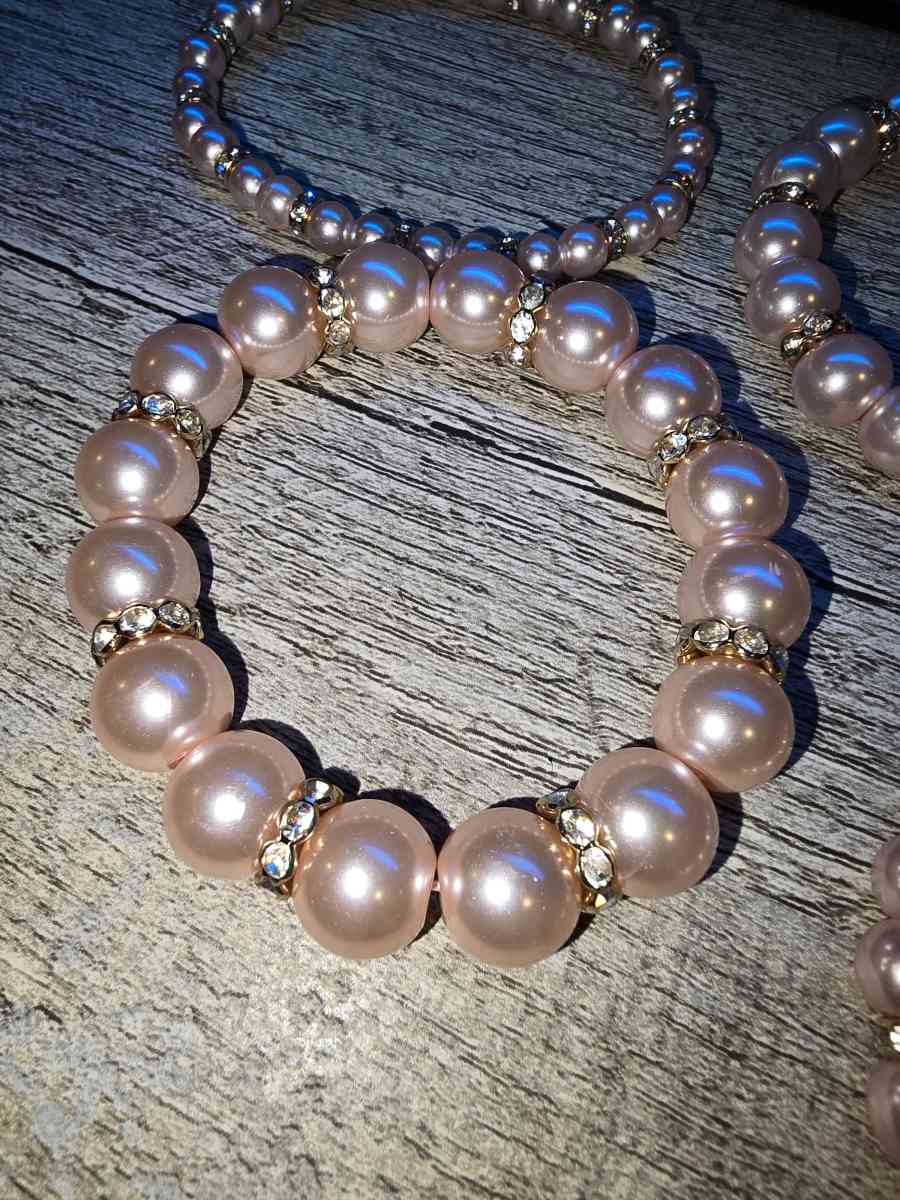 Brand New never worn set of 4 pink pearl Bracelets