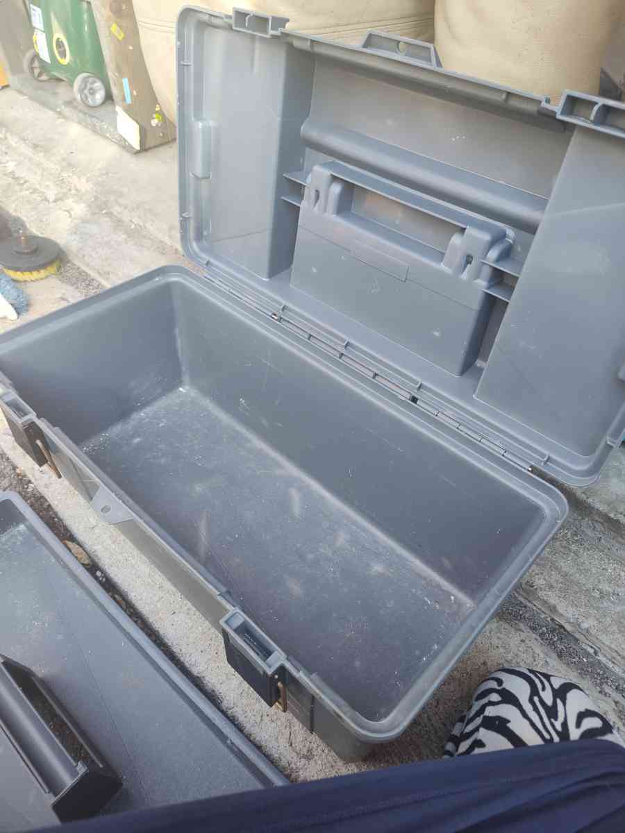 tool box with cleaning scrubbers and a drill