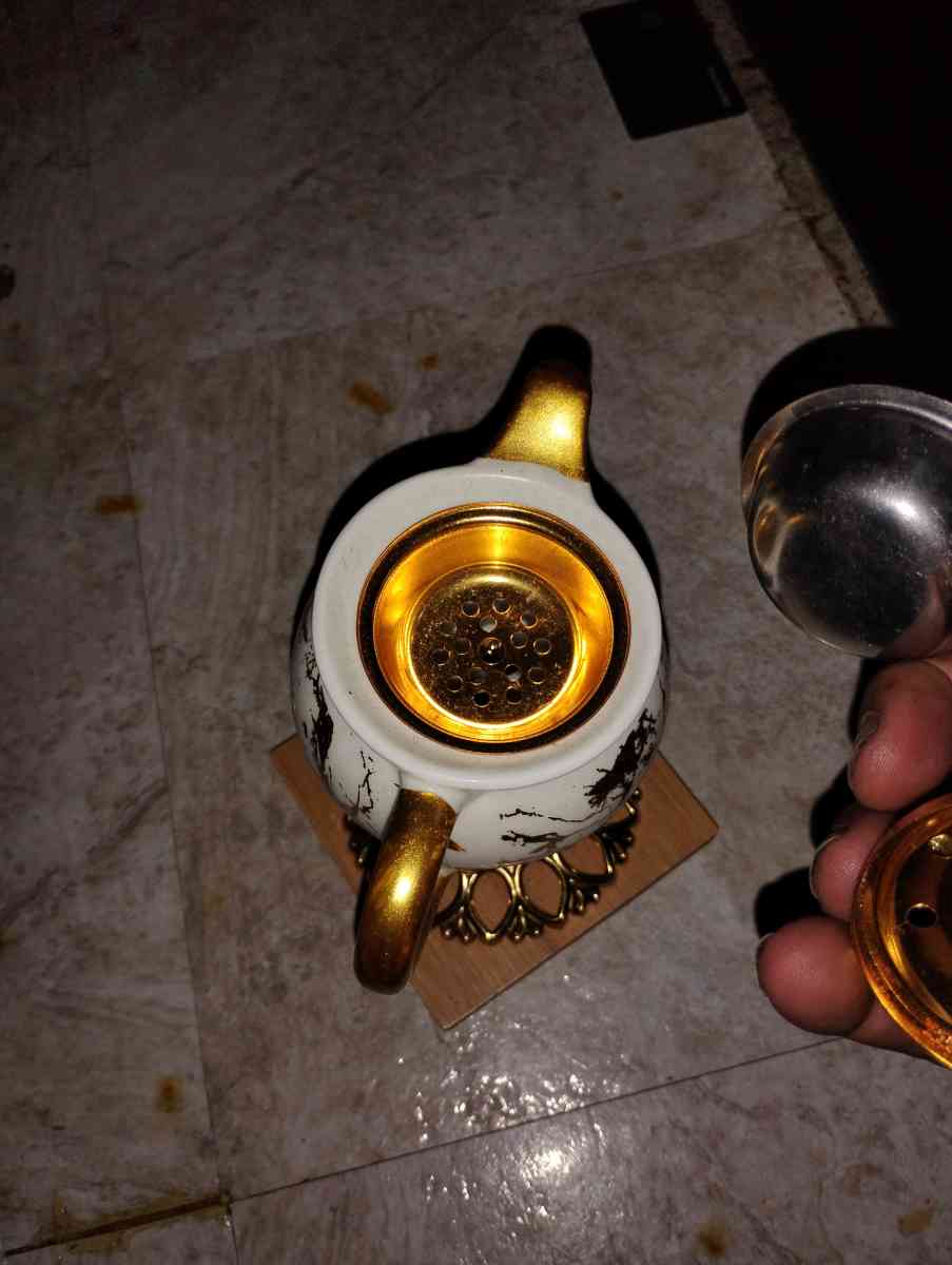 gold and white teacup