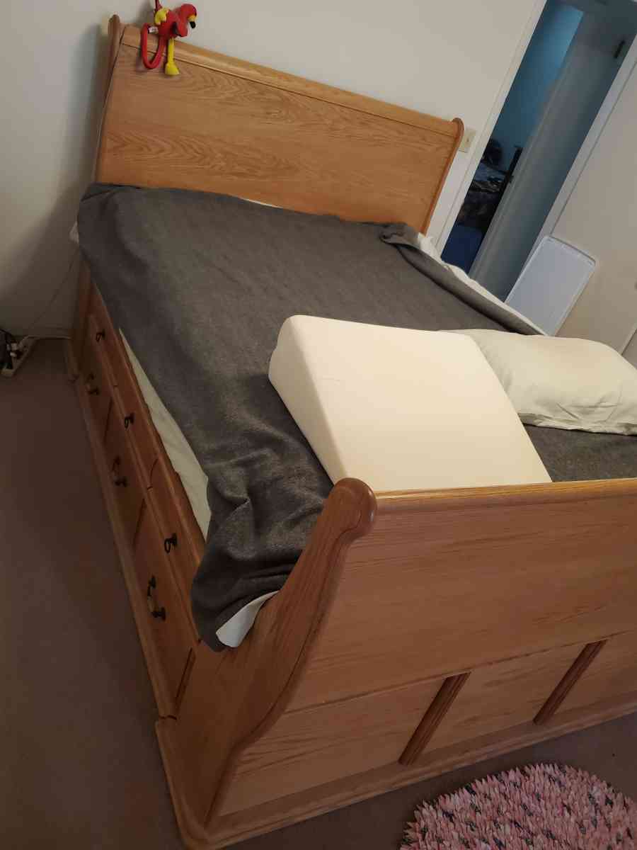 Solid oak queen sleigh platform bed with 12 drawers
