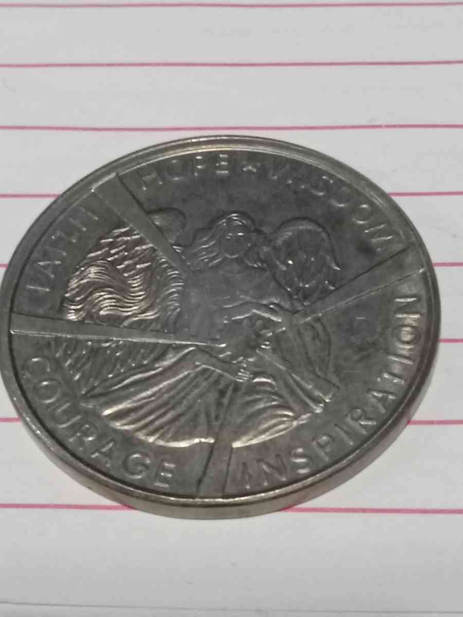 metal coin with  woman on it