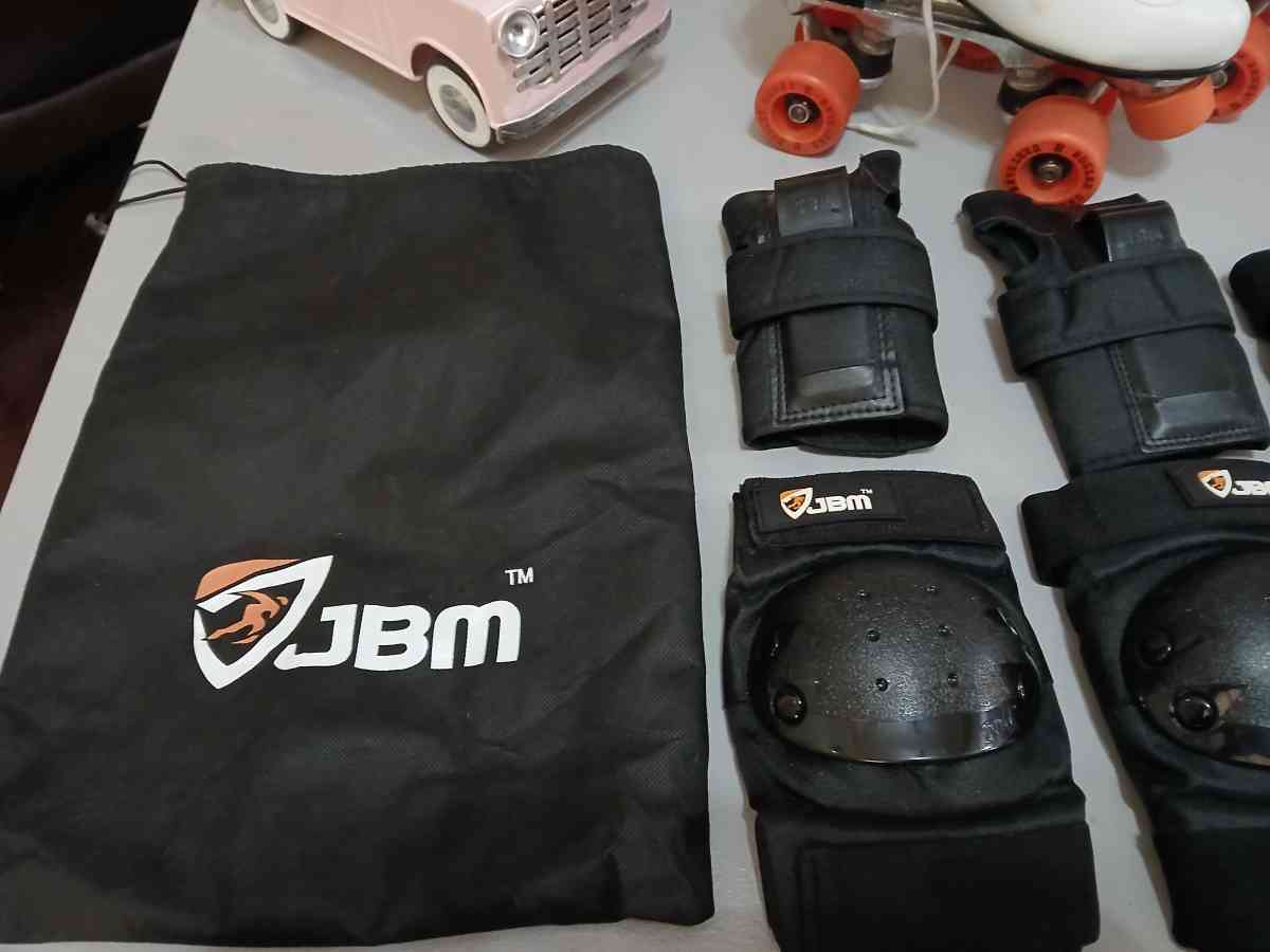 Roller Derby classic roller skates with pads and guards