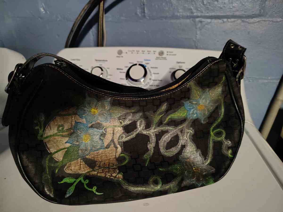 a black small purse Mine West