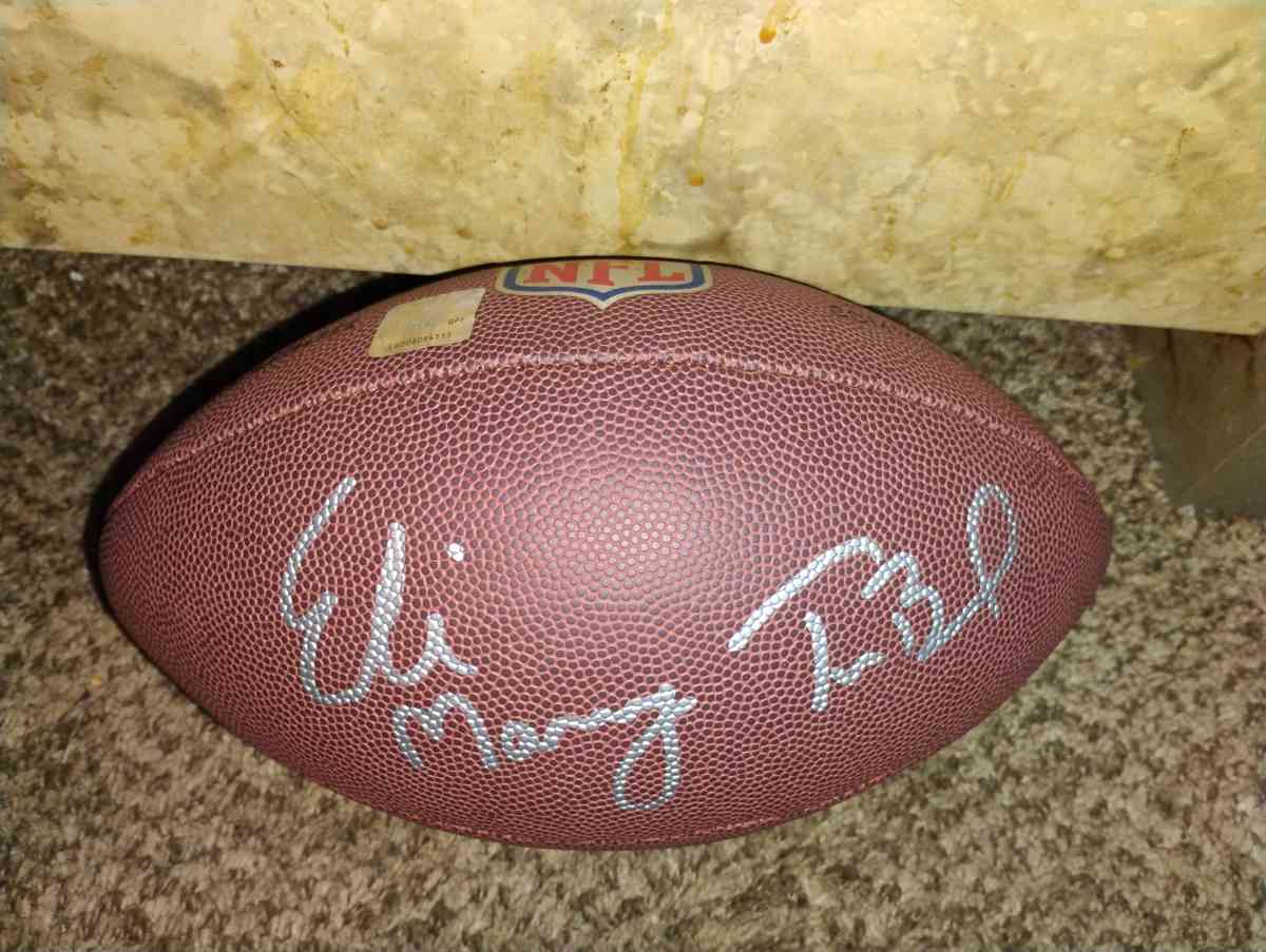 Tom Brady and Eli Manning signed football