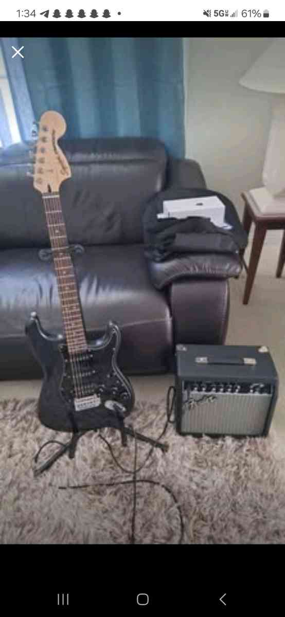 Black Electric guitar fender squier stratocaster