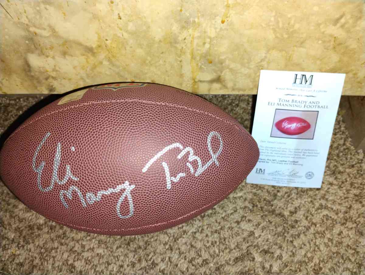 Tom Brady and Eli Manning signed football