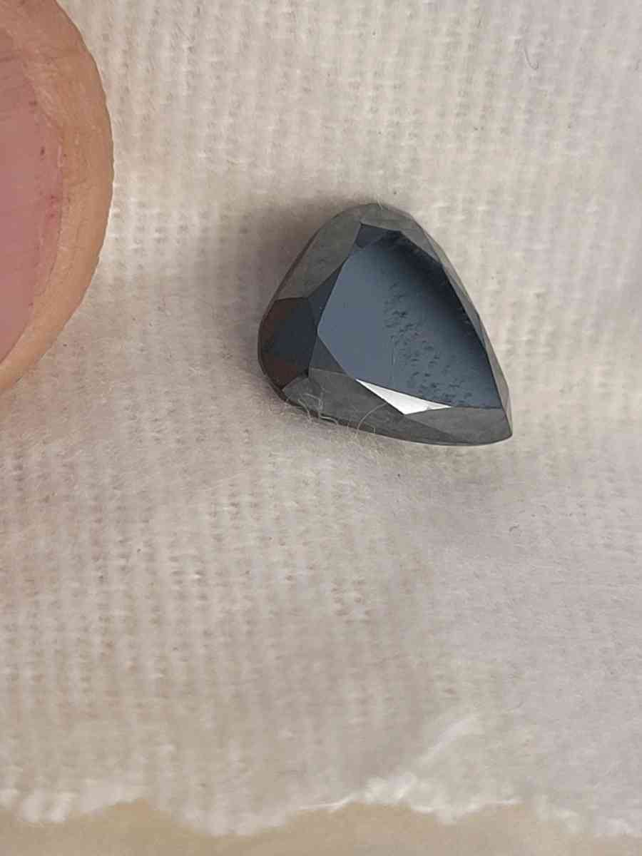 a nicely cut pearshaped black diamond