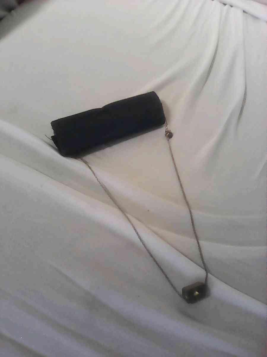 silver girl and woman necklace needs cleaning