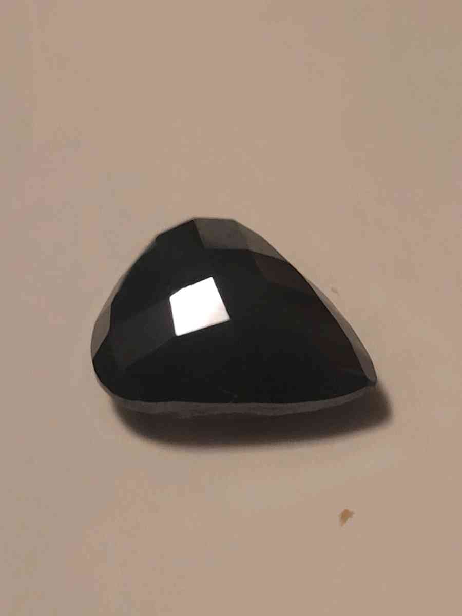 a nicely cut pearshaped black diamond