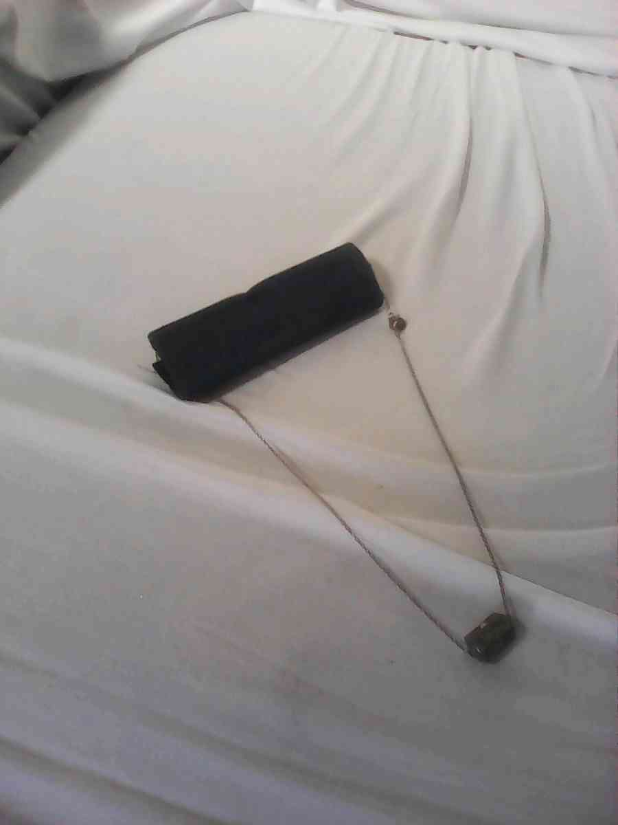 silver girl and woman necklace needs cleaning