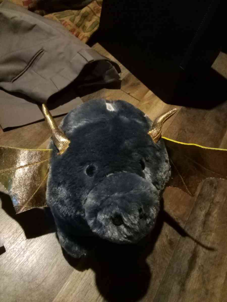 stuffed piggy bank with bat wings