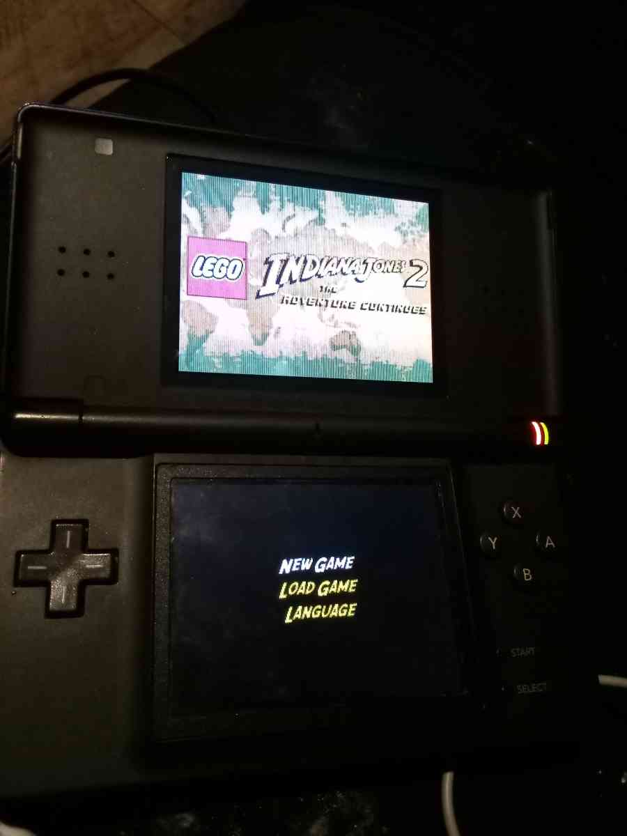 Nintendo DS with game and charger and pen