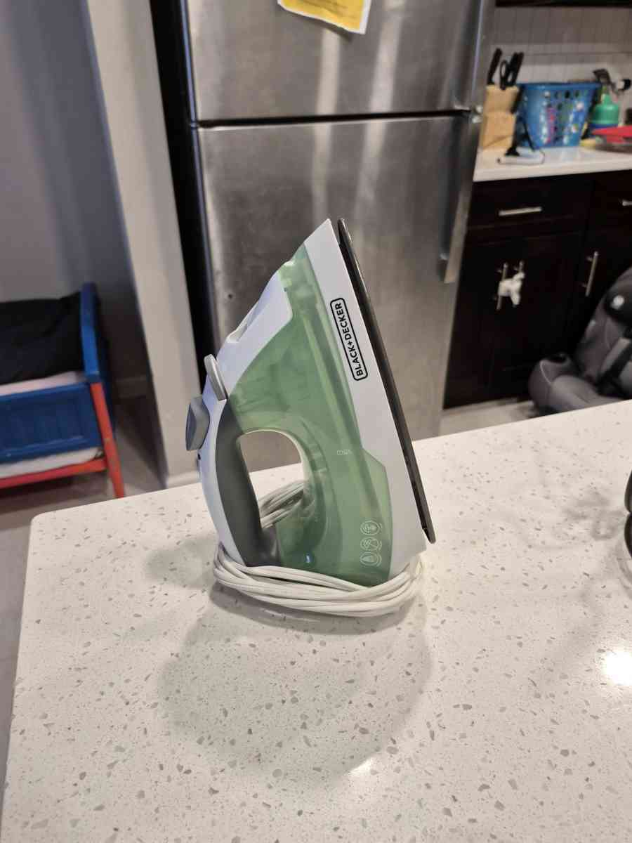 ironing board and iron and celebration glass