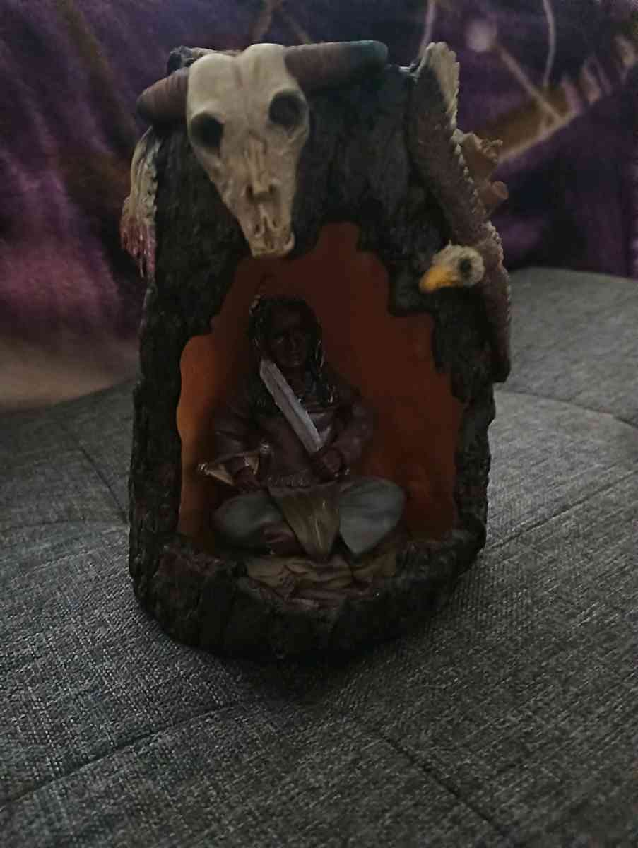 Indian in tree stump statue