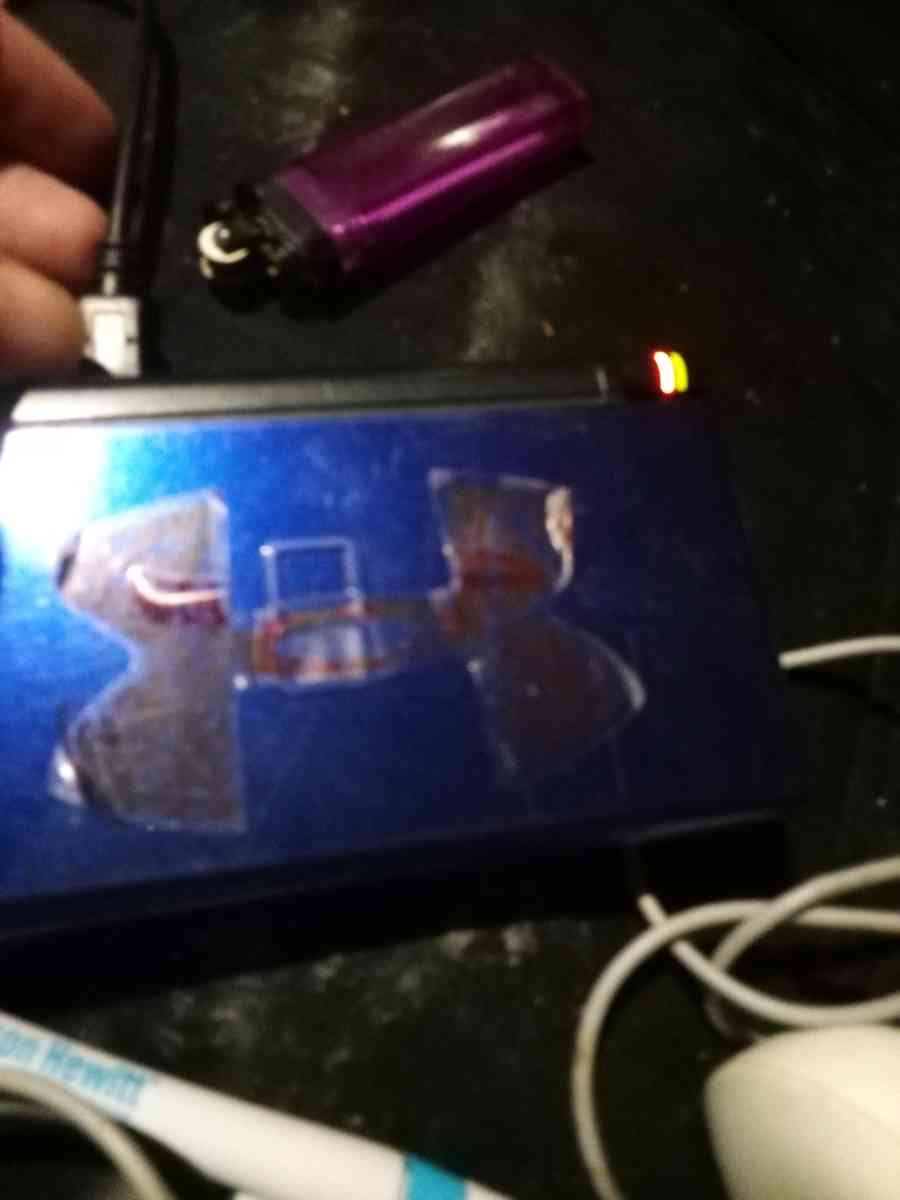 Nintendo DS with game and charger and pen