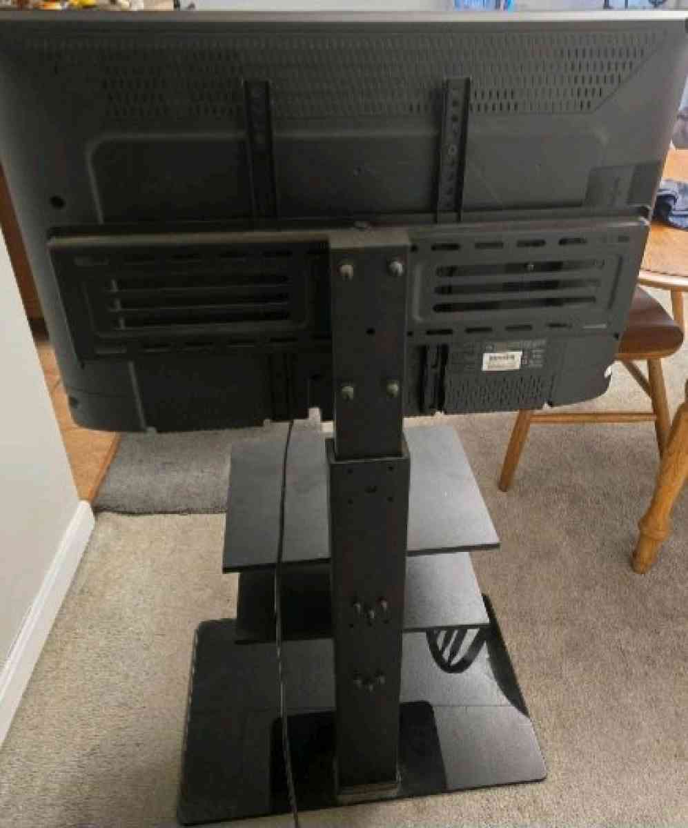 30 inch Emerson flat screen smart tv and 3 shelf TV stand