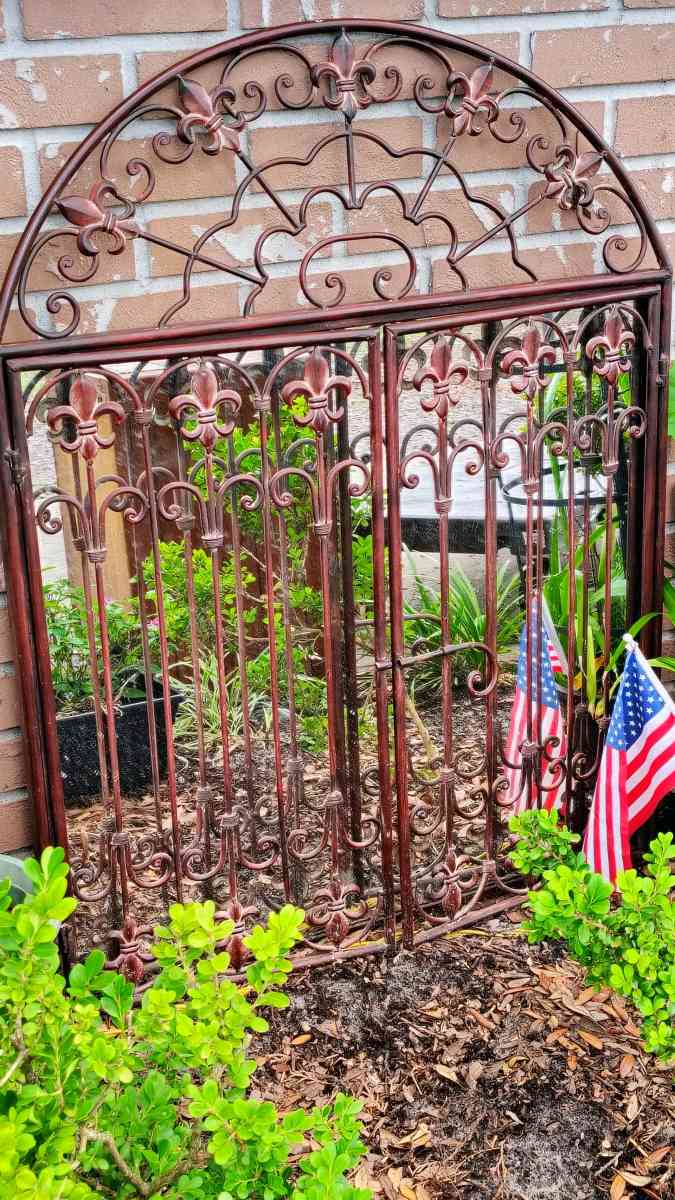 Antique mirror with wrought iron double doors