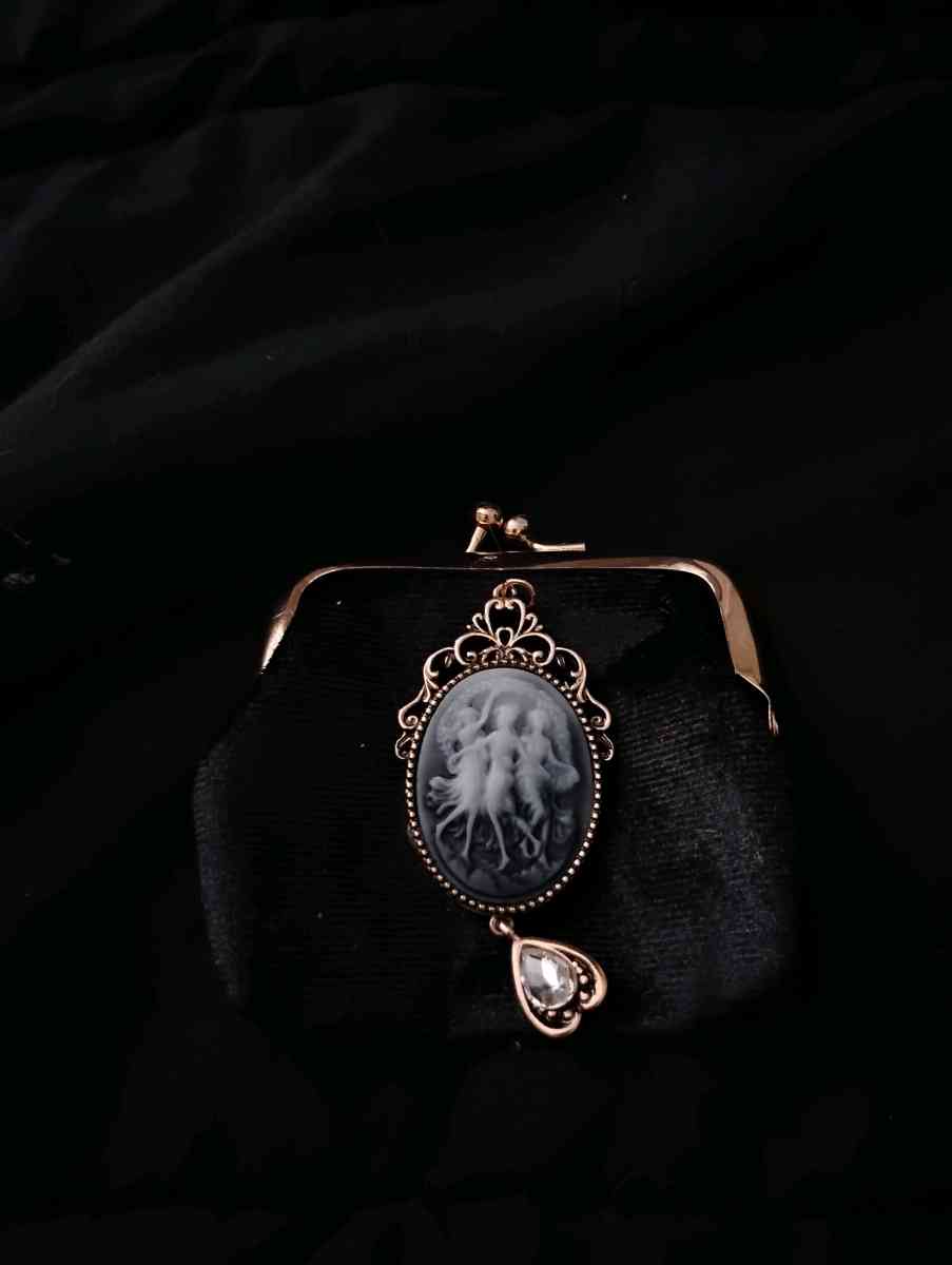 Black and gold money pouche