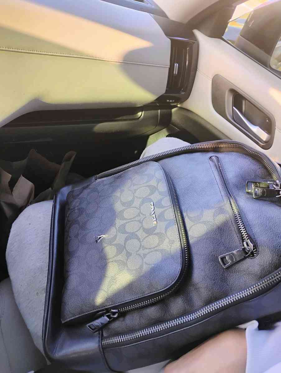 black leather Coach backpack