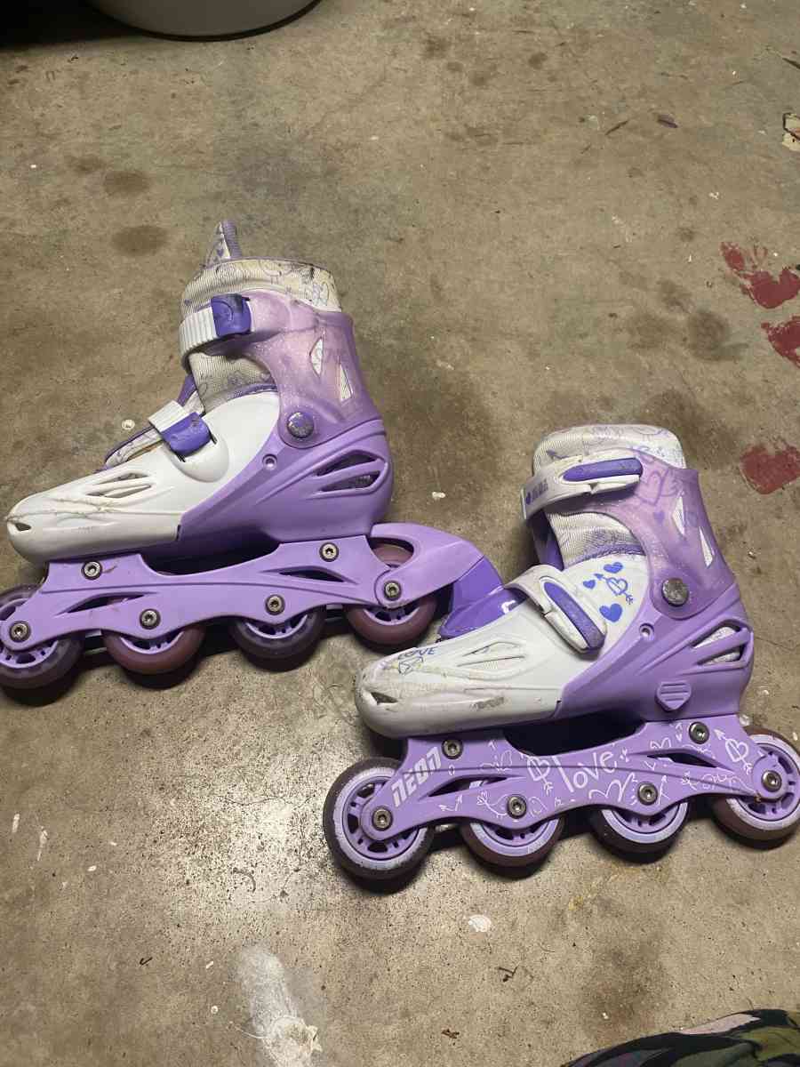 purple and white rollerblades