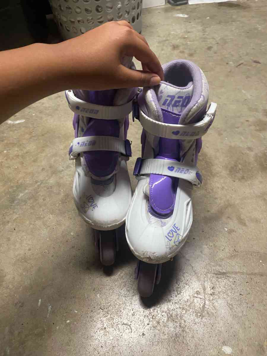 purple and white rollerblades