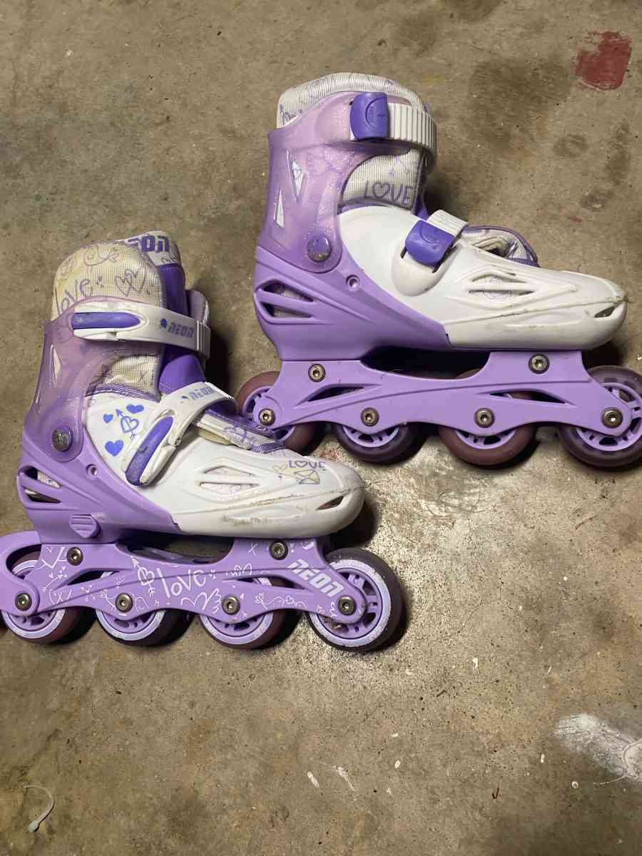 purple and white rollerblades
