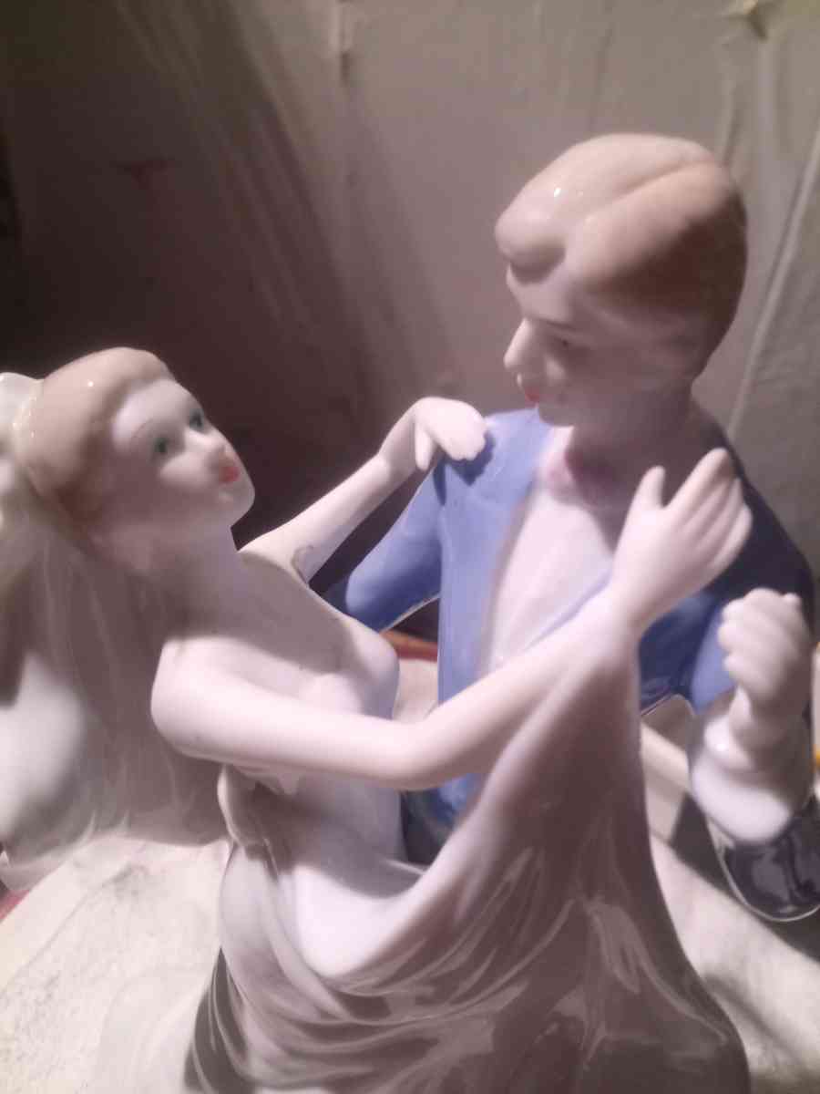 porcelain wedding figurine of man and woman