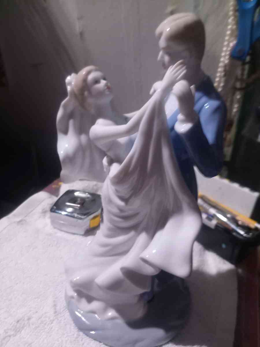 porcelain wedding figurine of man and woman