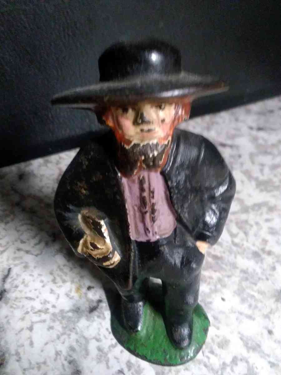 2 cast iron Amish people