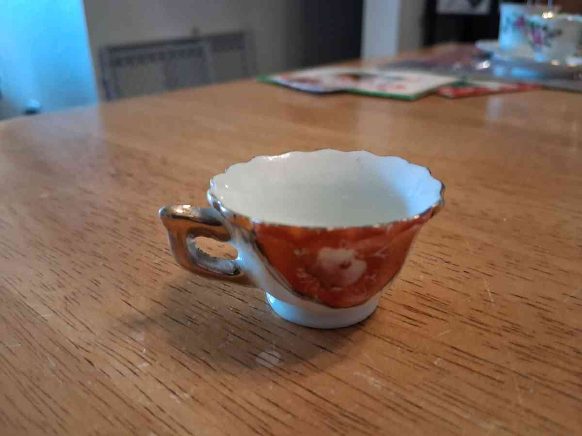 orange and pink flower design tiny teacup