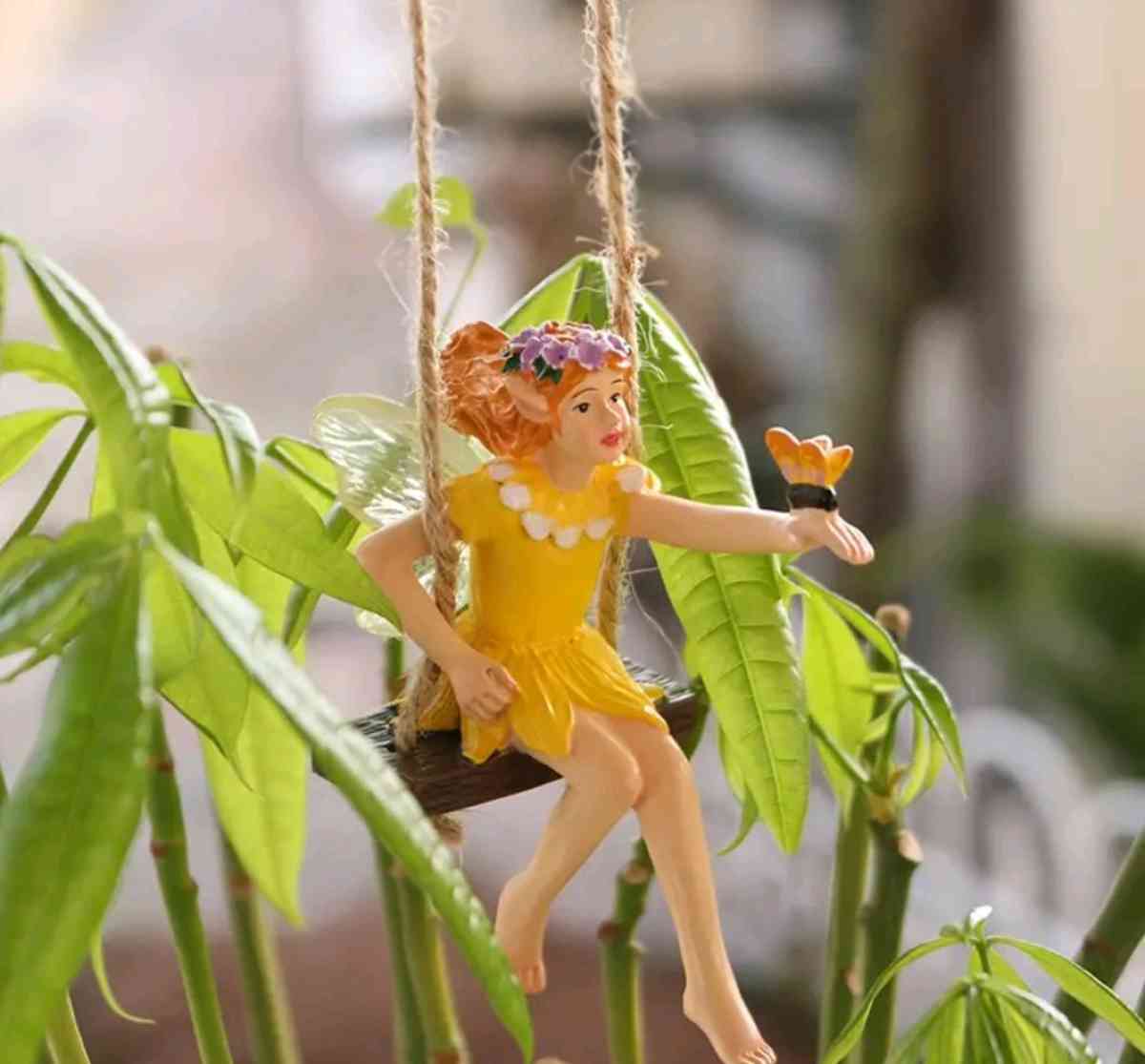 Fairy on a Swing with a butterfly