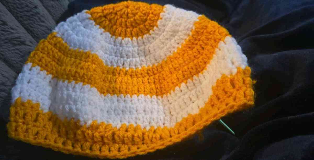 orange and white striped beanie