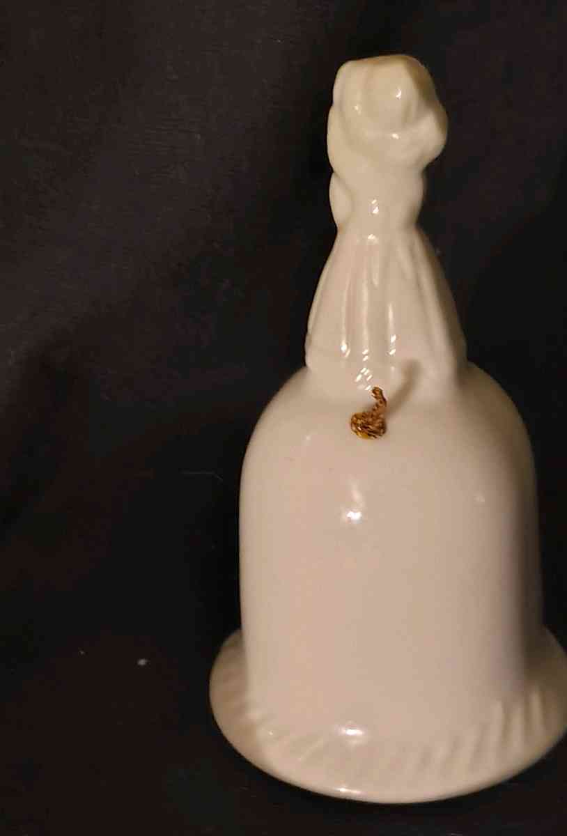 Girl standing on top of Bell