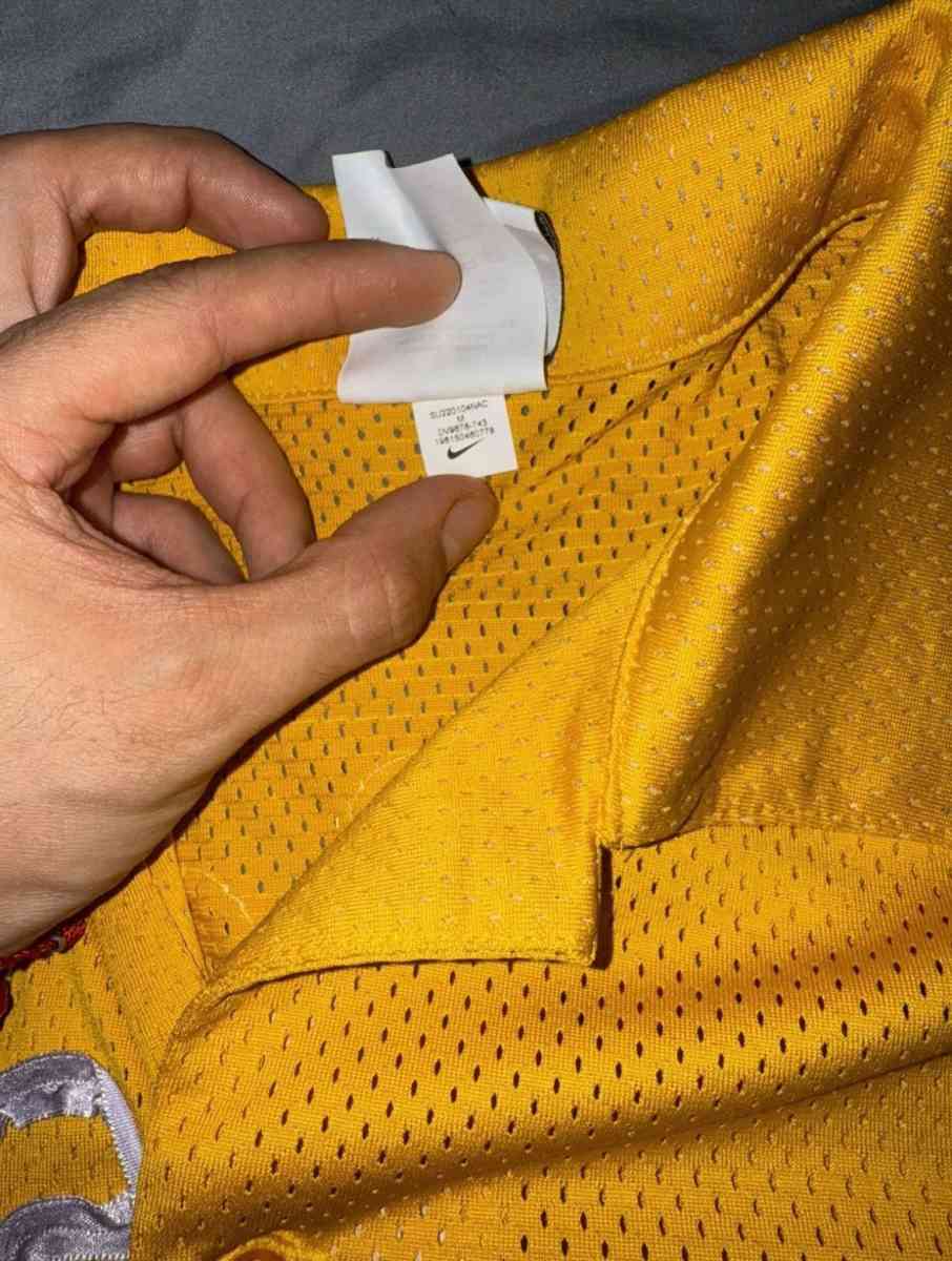yellow Nike shirt