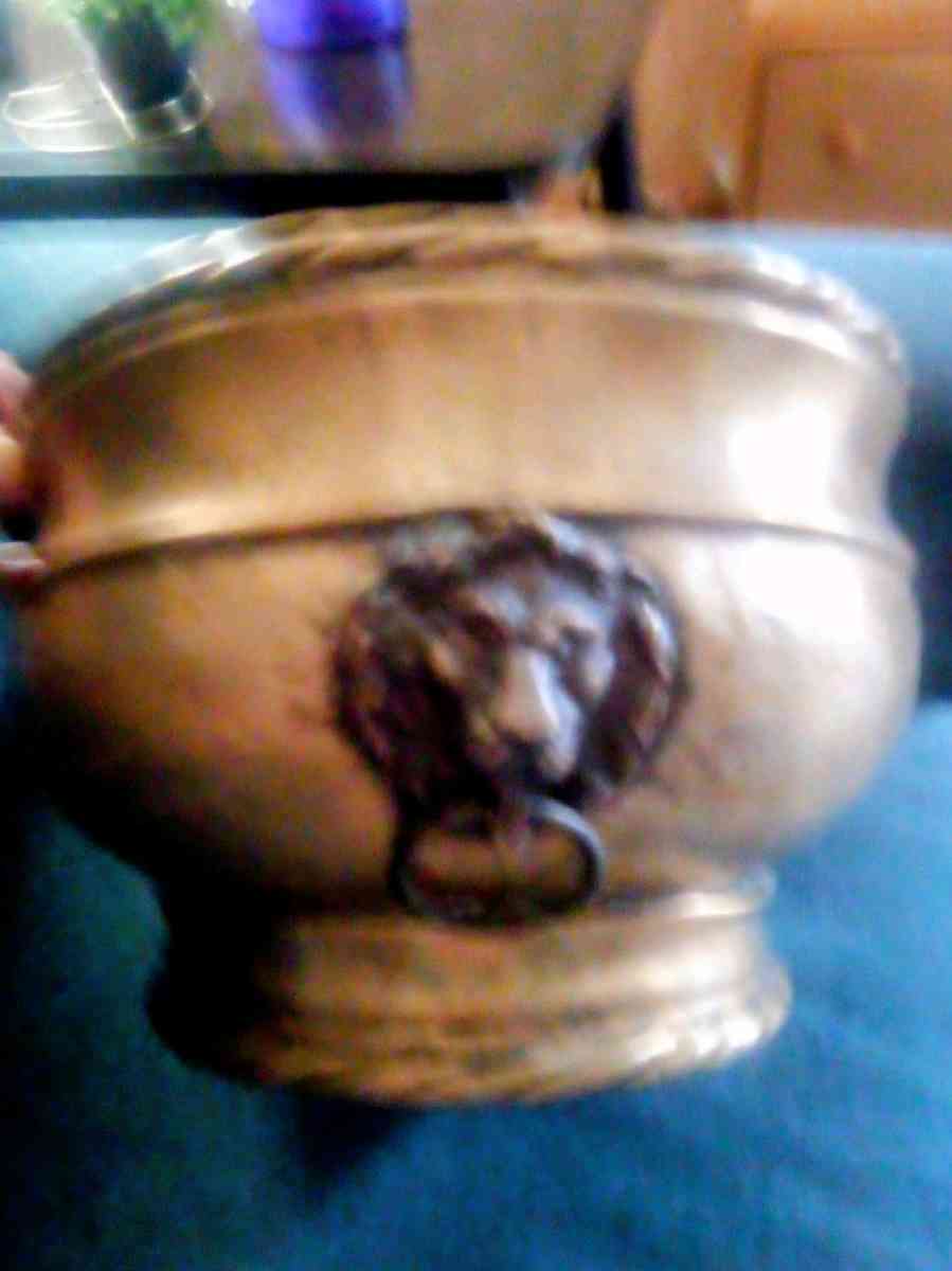 An Antique brass planter